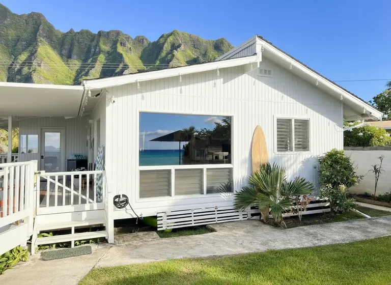 Beachfront Oahu vacation rental with sandy shoreline and clear water