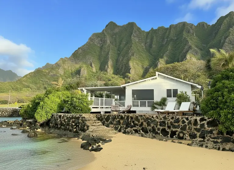 Beachfront Oahu vacation rental with sandy shoreline and clear water